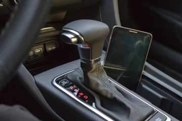 Modern car interior with smart phone