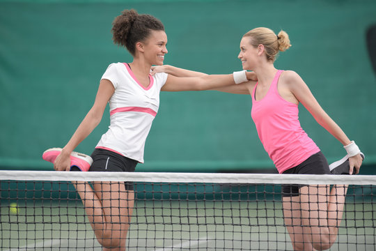 two happy female tennis player