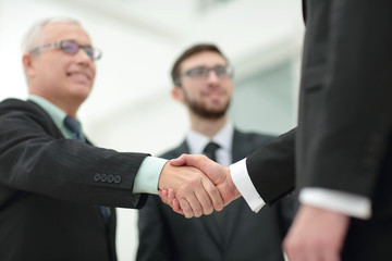 Fototapeta premium Concept of partnership - handshake of business partners