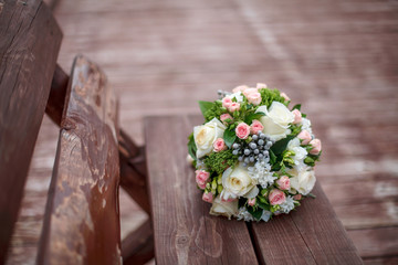 Beautiful wedding bouquet on wooden background