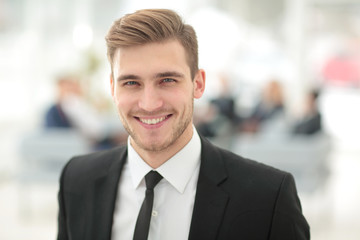 Portrait of happy businessman with  colleagues interacting on ba