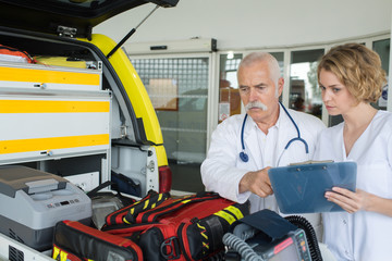 paramedics preparing ambulance © auremar