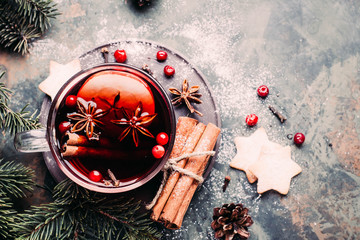Mulled wine with cowberry, cinnamon, apple and anise. Christmas or New Year drink. Top view and...
