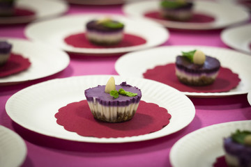 cheesecake bites with almond and mint leaf