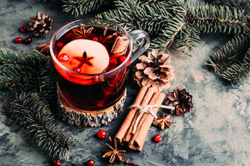 Mulled wine with cowberry, cinnamon, apple and anise. Christmas or New Year drink. Top view and...