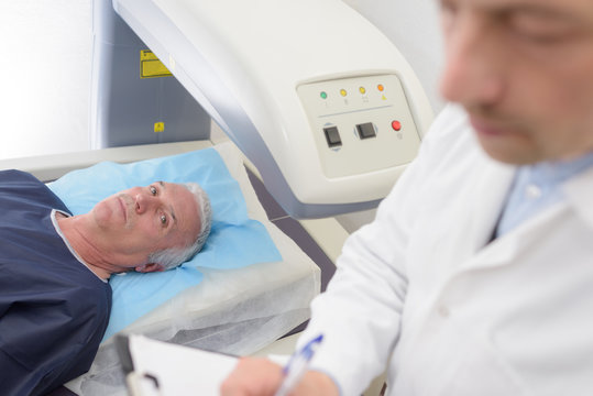 senior patient undergoing mri scan at hospital