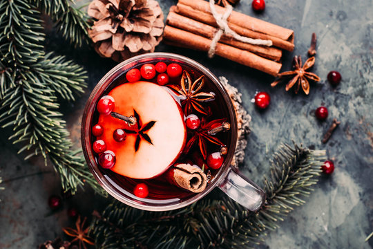 Mulled wine with cowberry, cinnamon, apple and anise. Christmas or New Year drink. Top view and copy space.