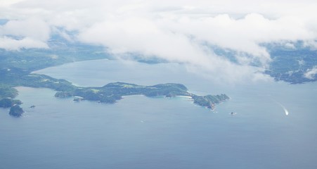 Fototapeta na wymiar Aerial view in the clouds of rhe Golfo del Papagayo with the Peninsula Papagayo near Liberia, Costa Rica
