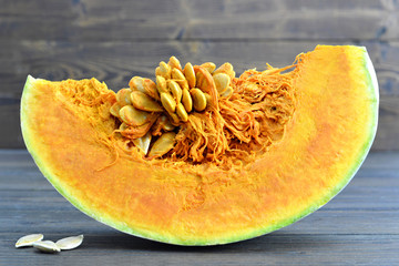 Pumpkin slice on wooden background