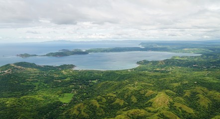 Aerial view in the clouds of rhe Golfo del Papagayo with the Peninsula Papagayo near Liberia, Costa Rica - obrazy, fototapety, plakaty