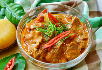 Thai menu  Panaeng Curry with beef and fresh kaffir lime leaves,coconut sugar and sliced chili .
Beef in ground peanut-coconut cream curry.
