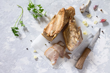 Raw meat layer. Raw raw pork lard on a gray stone background wit