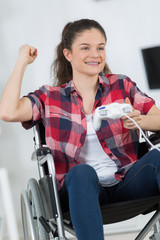 young female enjoying video games at home