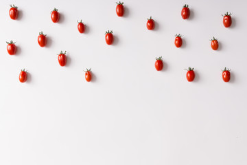 Cherry tomatoes pattern on white background