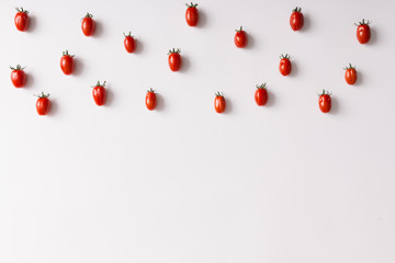 Cherry tomatoes pattern on white background