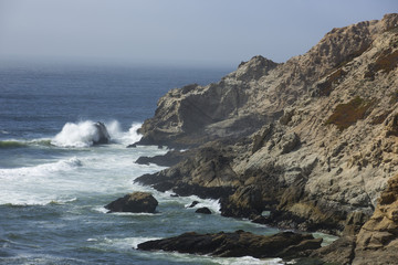 Fototapeta na wymiar Rocky piece of California coastline at Montara State, south of San Francisco near Half Moon Bay. California.