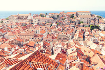 Fototapeta na wymiar Dubrovnik old town roofs. Aerial view. Cityscape of Dubrovnik with bird's eye view. Travel to Croatia