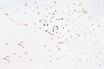 Holiday background with silver star confetti. Good background for Christmas and New Year cards.