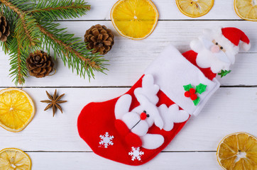 Christmas stocking on a wooden background.