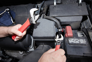 Car mechanic with wrench.