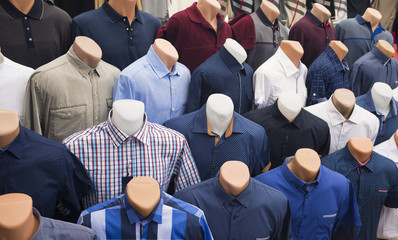 The range of men's shirts on mannequins in the market (selective focus)