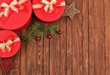 Naklejka na ściany i meble Christmas presents with decor on wooden background