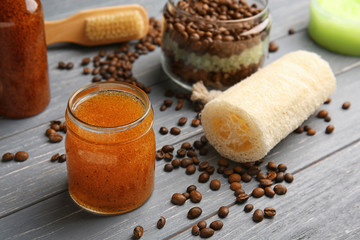 Jar with scrub on wooden table, closeup