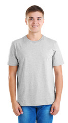 Fototapeta premium Handsome young man in blank grey t-shirt on white background