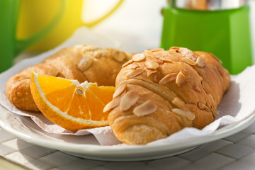 Breakfast with coffee on hotel's balcony, fresh croissants and s