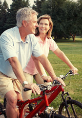 Senior couple with bicycle.