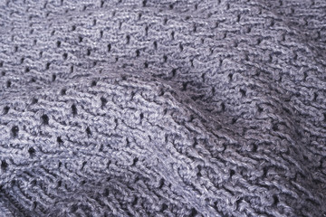 Knitted fabric texture. Knitted fabric background. Background from knitted fabric.