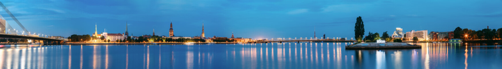 Fototapeta premium Riga Latvia. Panoramic Urban View Of Daugava, Landmarks In Illumination
