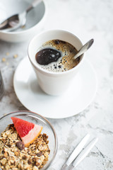 healthy breakfast: granola in bowl with coffe
