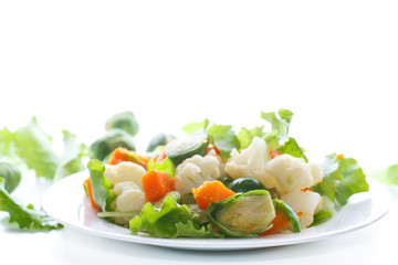 salad of lettuce, cauliflower and Brussels sprouts with a pumpkin