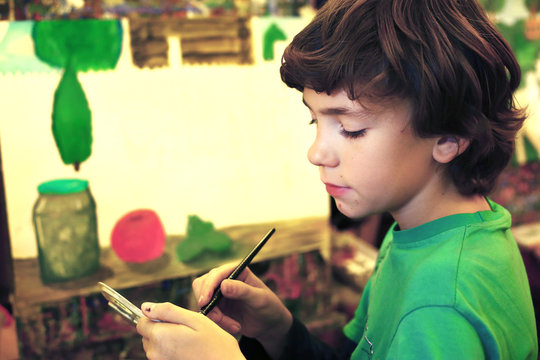 teen handsome boy painting picture still life