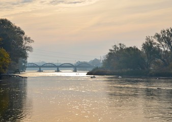 view along the Grand River, with te istoric bridge in the background; Caledonia, Ontario Canada