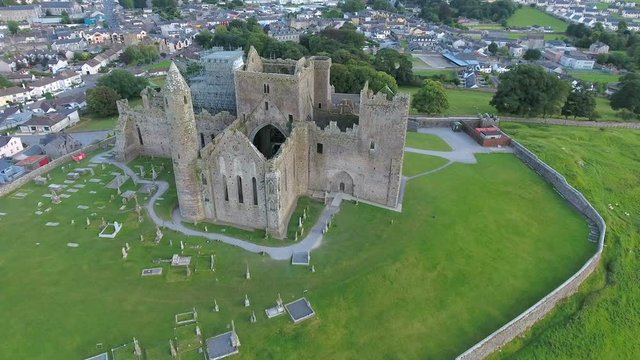 Aerial view of the Rock of Cashel with the cross tombs on the front of the castle that is located on a hill in Ireland