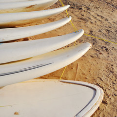 none brand surf boards on beach