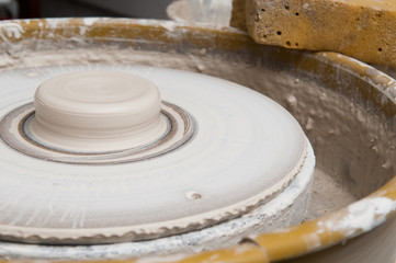 Pottery wheel in the studio making ceramic products