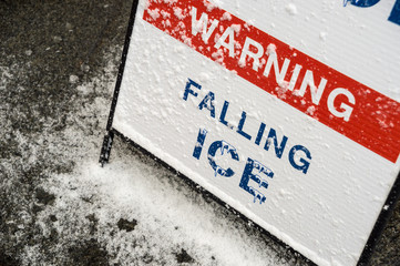 "Warning -  Falling ice" red and white sign in Montreal, Canada