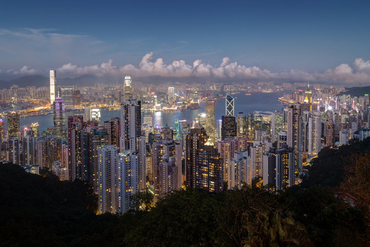 Scenic view of Hong Kong's famous skyline as seen from the Victoria Peak in the evening. Copy space.