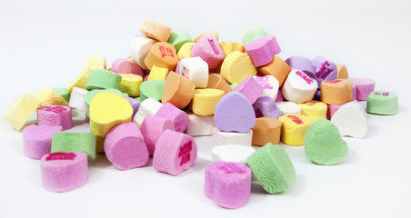 Pile of colorful Valentine candy hearts. Horizontal.