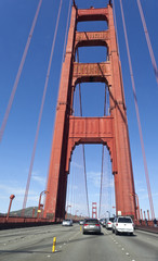 Traffic crossing the Golden Gate Bridge. Vertical.