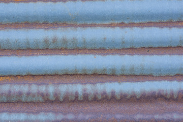 Rusty corrugated metal wall close up background