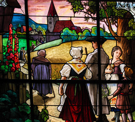 Obraz na płótnie Canvas Family walking towards Church - Stained Glass