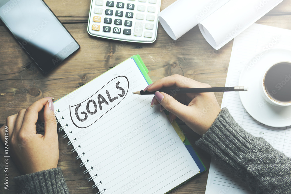 Poster goals text on notebook