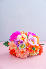 Bouquet of handmade paper flowers lying on a table