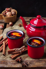 Obraz na płótnie Canvas Hot mulled wine in a red mug for winter holidays