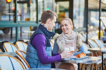 Romantic couple in cafe in Paris, France
