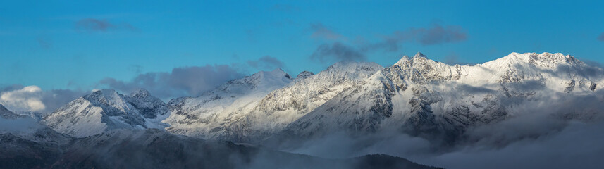 Snow-covered mountains at sunrise. Adzharo-Imeretinskiy Range. 